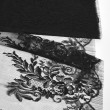 Tissu Dentelle de calais noir motif arabesque x10cm